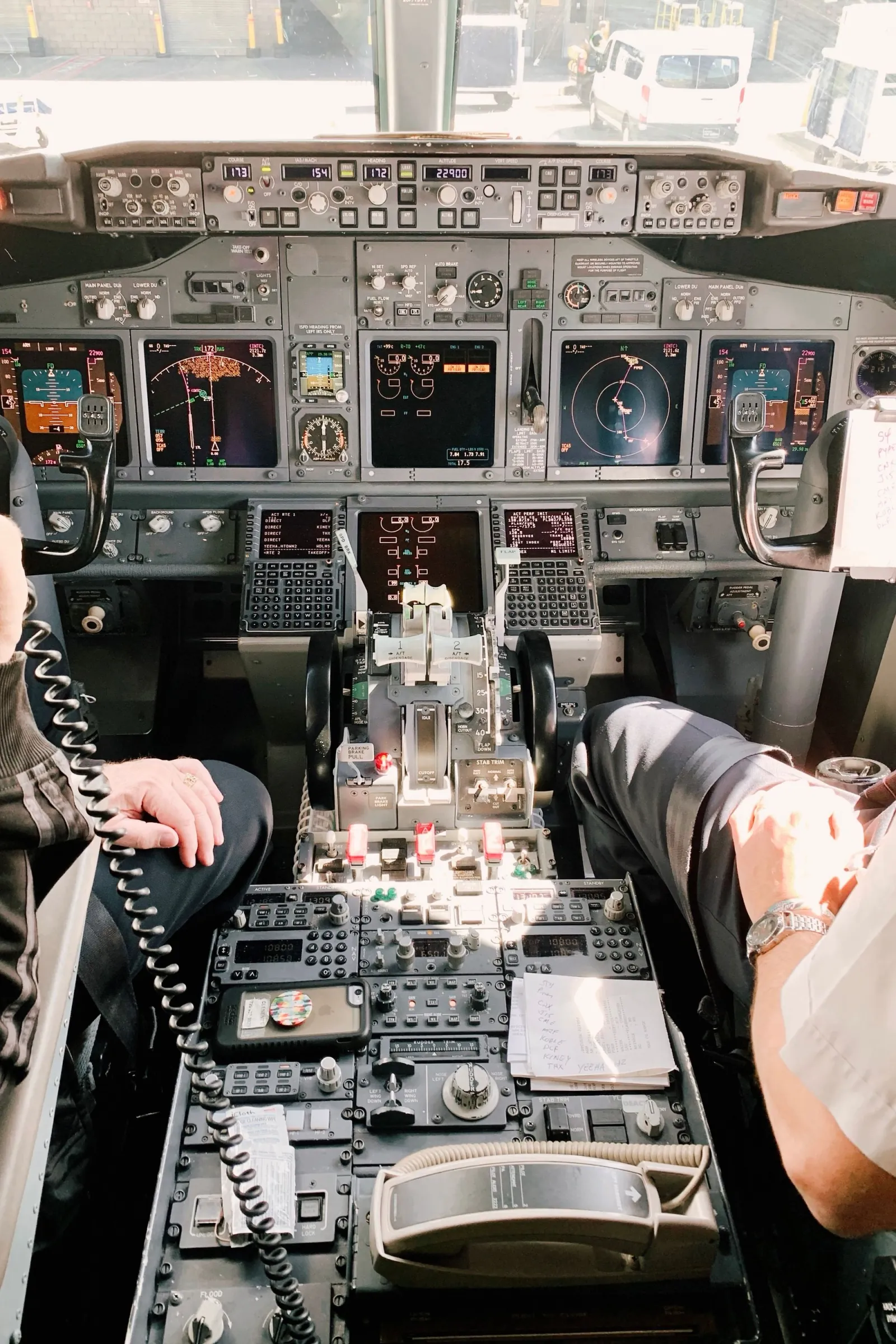 Pilots reviewing the aircraft flight deck before departure